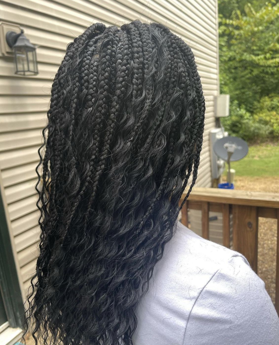 Boho braids with curly ends from behind